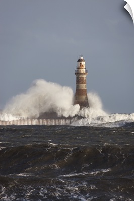 Waves Crashing Against A Lighthouse; Sunderland, Tyne And Wear, England