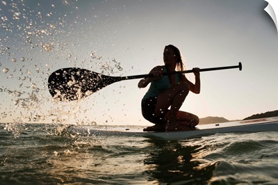 Woman Paddling While On Her Knees On Surf Board, Tarifa, Andalusia, Spain