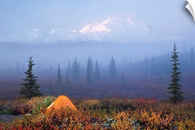 Wonder Lake campground with tent in the foreground and Denali partially osbsured by fog