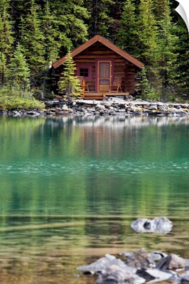 Wooden Cabin Along A Lake Shore