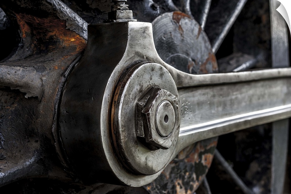 A close-up photograph of the wheel of a train.