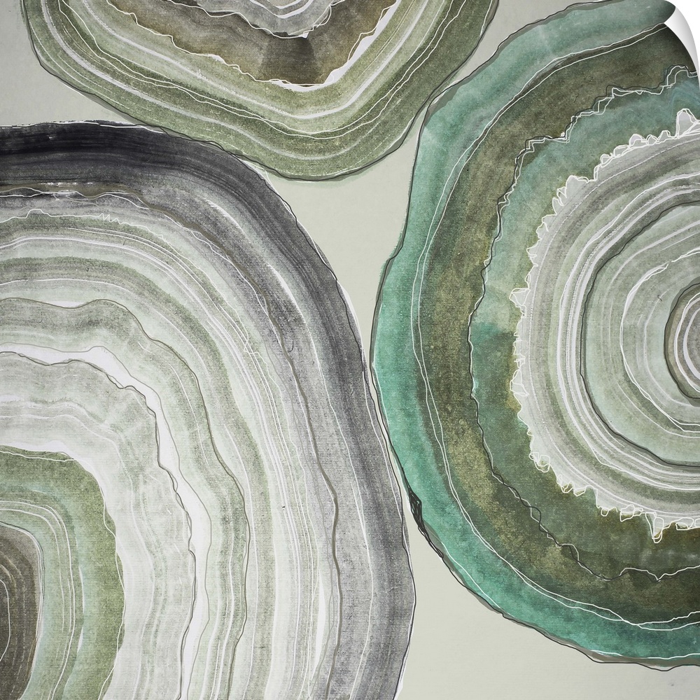 Contemporary home decor artwork of pale colored geode cross sections against a gray background.