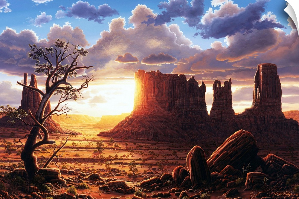 The sun setting behind the rock formations of Monument Valley.