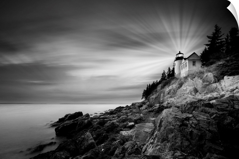 A black and white photograph of a lighthouse on the coast of Maine.