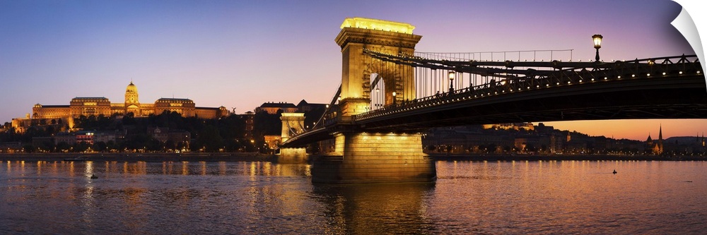 Panoramic photograph of the Chain Bridge in Budapest at dusk.