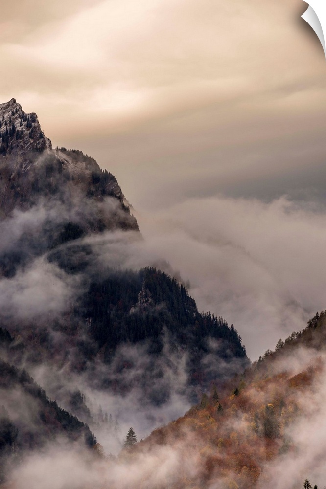 Landscape photograph of foggy mountain cliffs.