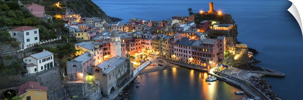 A photograph of an Italian coastal village atop a cliff.