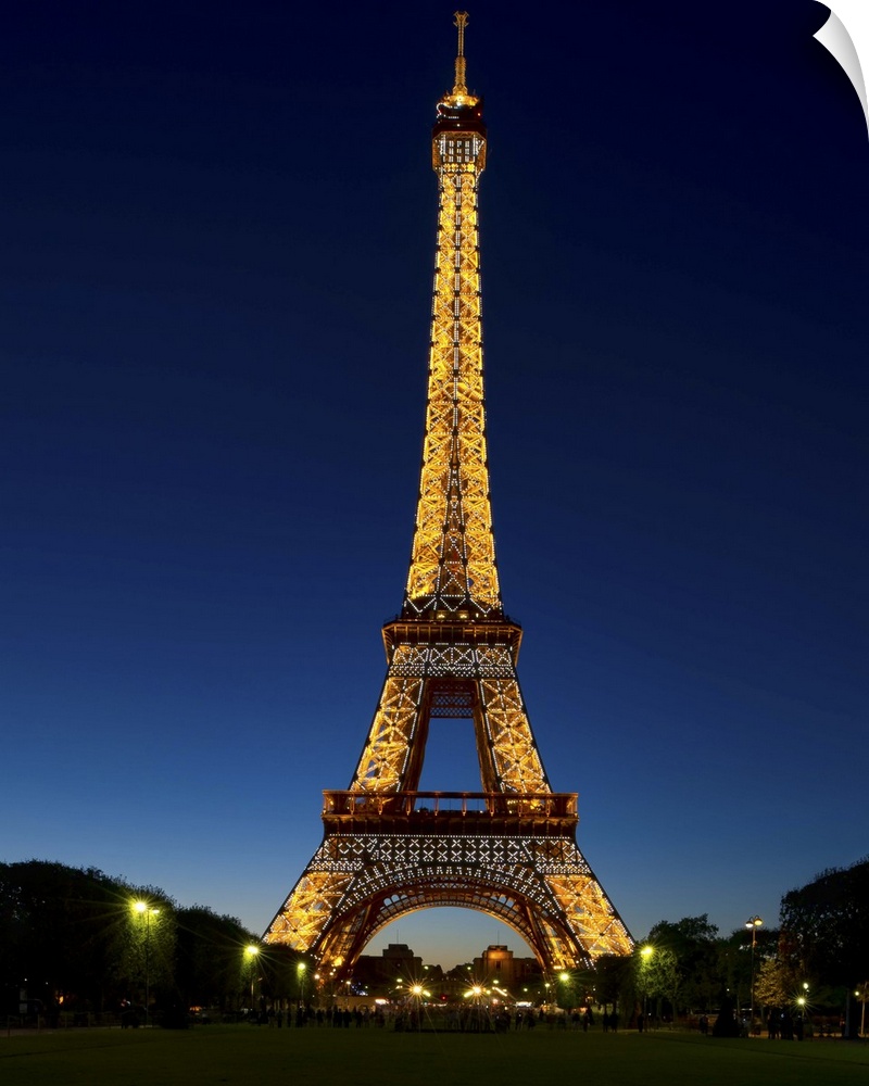 A photograph of the Eiffel Tower seen at night.