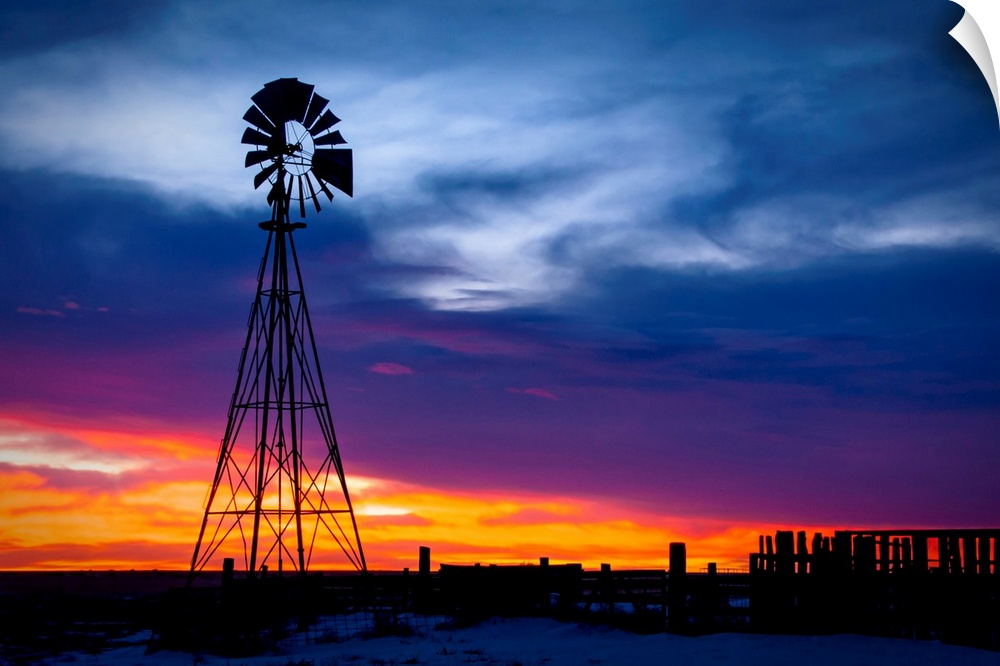 Windmill on a farm at sunrise, color photography