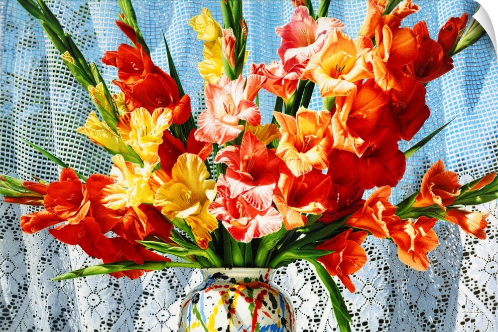 Contemporary vivid realistic still-life painting of bright red orange and yellow flowers in a multi-colored vase, against ...