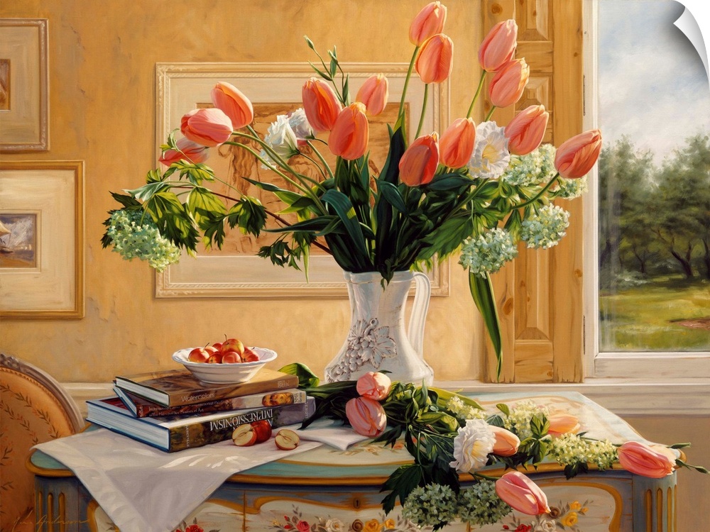 Vase of french tulips and assorted flowers on a table with books on it and a window in the background.