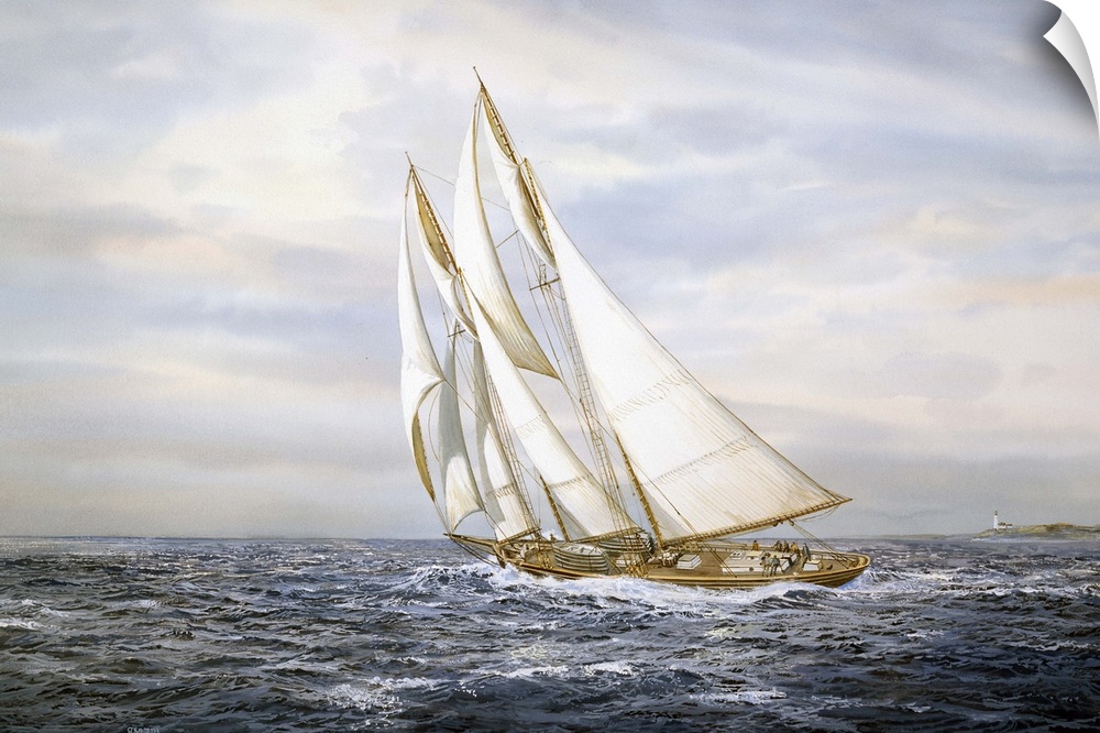 A ship with large sails sailing on ocean.