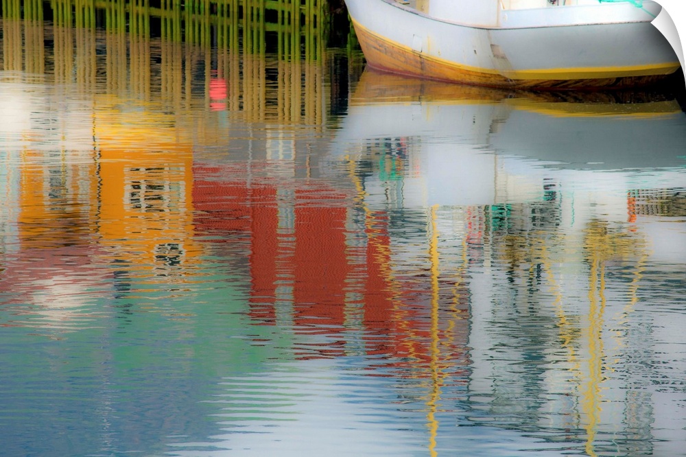 Reflections of buildings around the harbor onto the water with a boat in the corner.