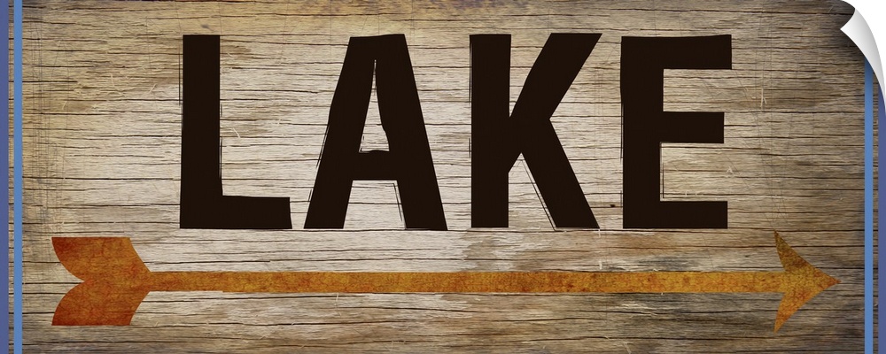Wooden sign with an orange arrow, 2 blue lines on each side, and the word "Lake" written across it.