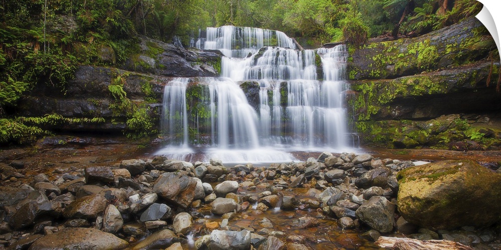 A photograph of a multi-leveled waterfalls