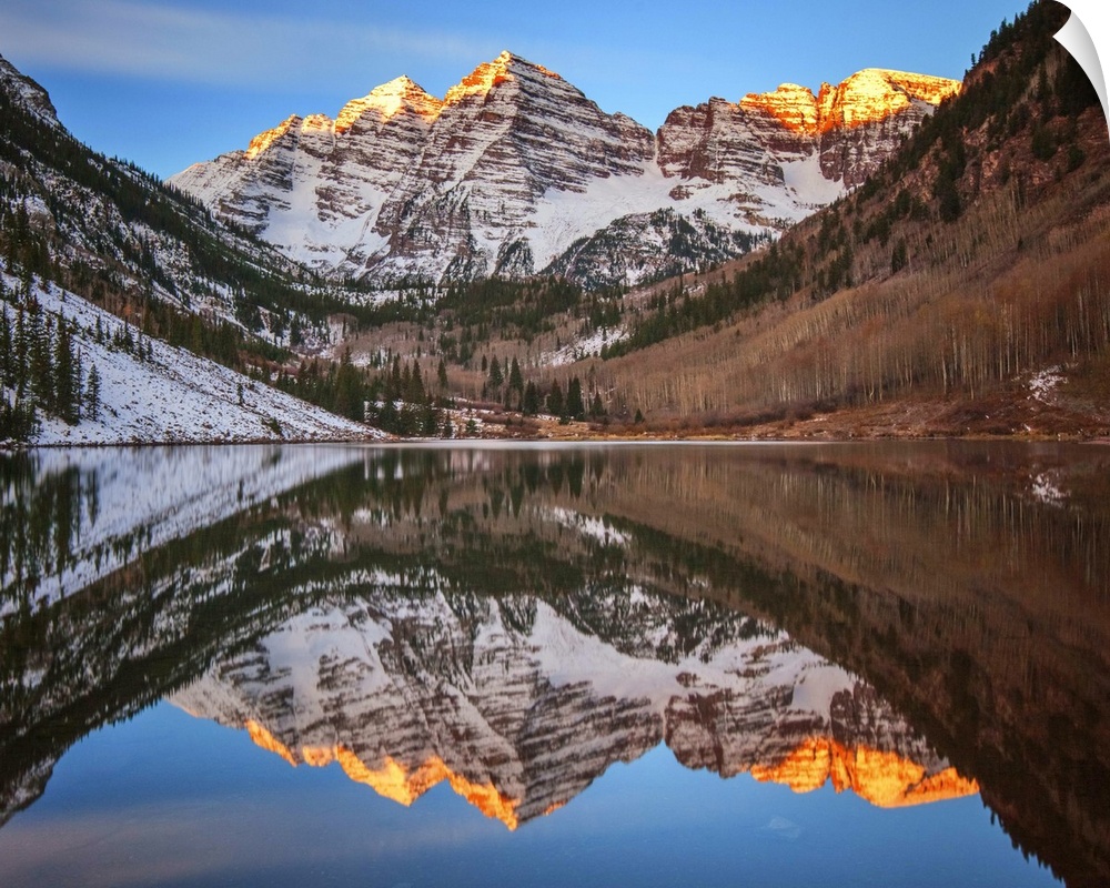 Sunlight on the peaks of the Maroon Bells, reflected in the lake below.