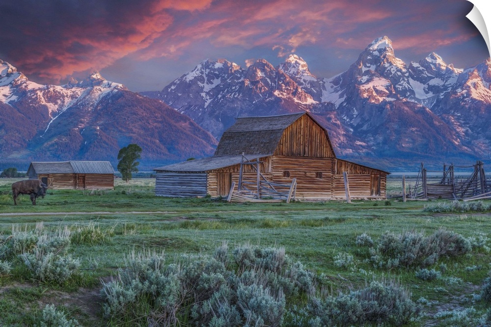 A photograph of the Mormon Row Barn in Wyoming, with the Teton mountains in the background.