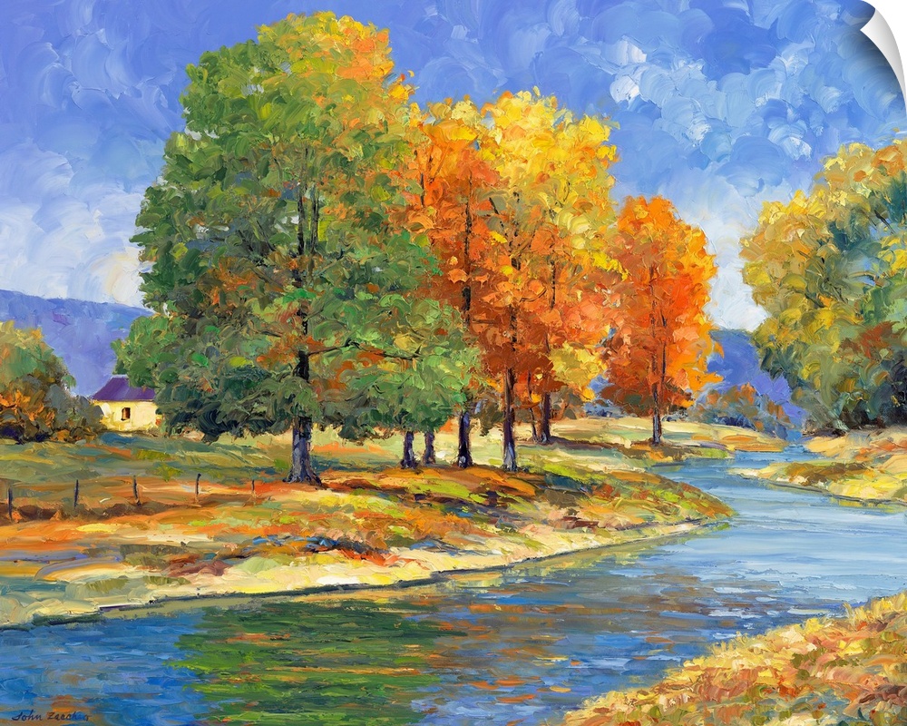 trees with changing color leaves along a riverautumn