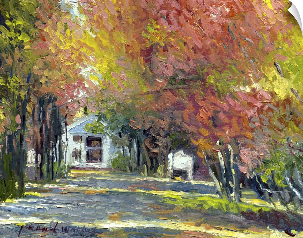 White house at the end of a lane in fall.