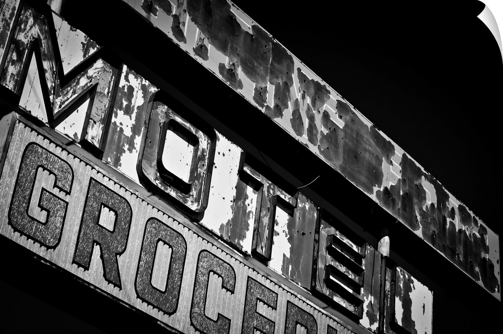 Black and white photograph of a vintage motel sign.