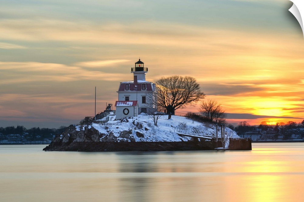 A photograph of a lighthouse under a sunset sky.