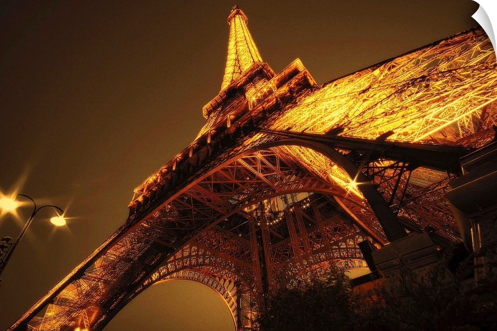 Angled shot of landmark in France brown and yellow toned photoeiffel tower paris