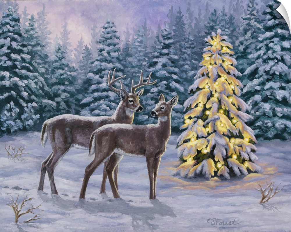 A pair of deer standing in the snow next to a lit Christmas tree.
