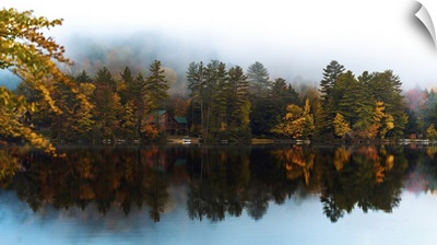 A Lake House From The Dock In Fall