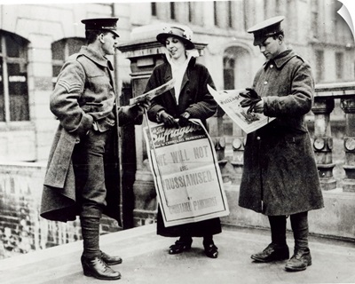 A Suffragette selling newspapers to two soldiers, c.1914