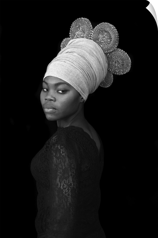 A stunning contemporary black and white portrait of a young Black woman wearing an elaborate wrapped headcovering