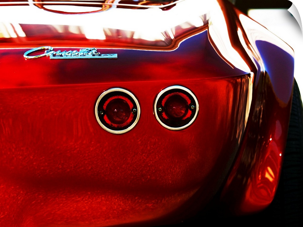 Photograph of the rear and break lights of a red 1963 Corvette Stingray 15.