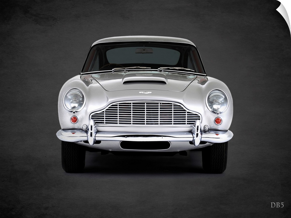 Photograph of a silver 1965 Aston Martin DB5 printed on a black background with a dark vignette.