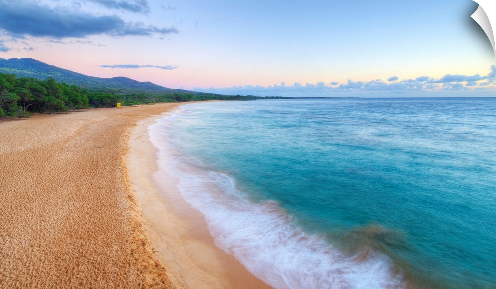 Landscape photograph of an empty beach scene with crystal blue water in Maui.