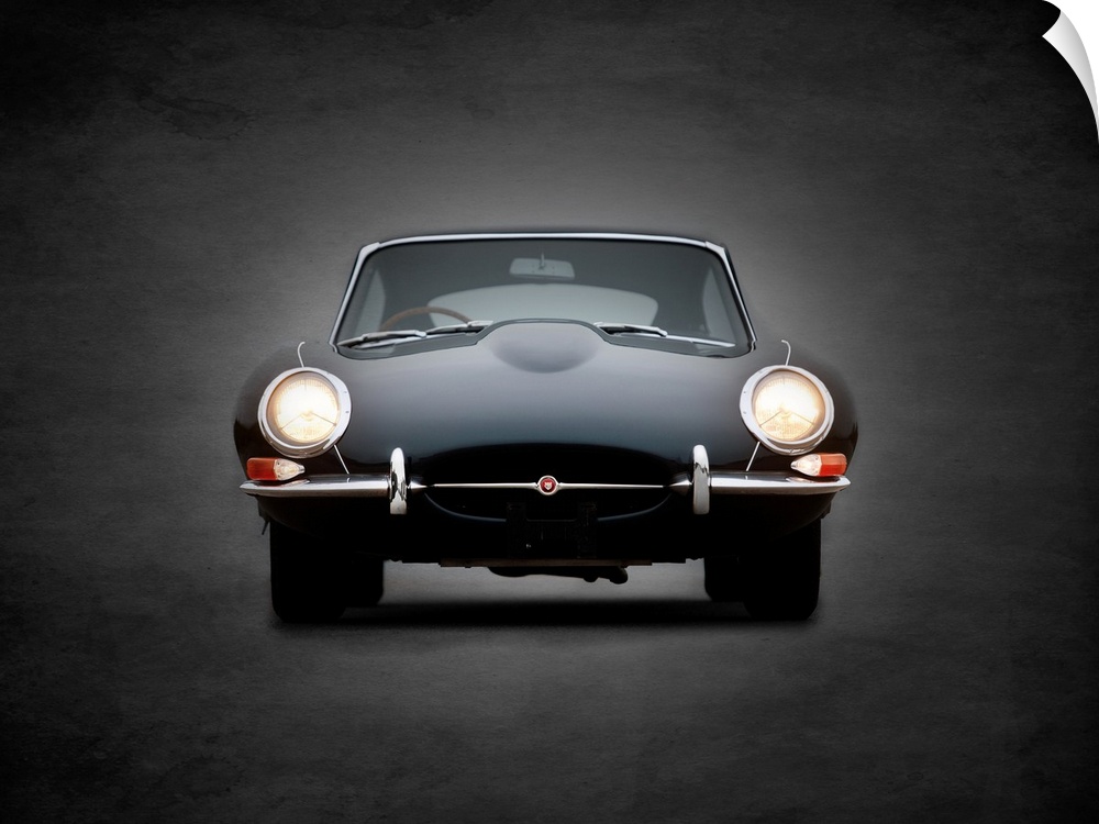 Photograph of a black E-Type printed on a black background with a dark vignette.