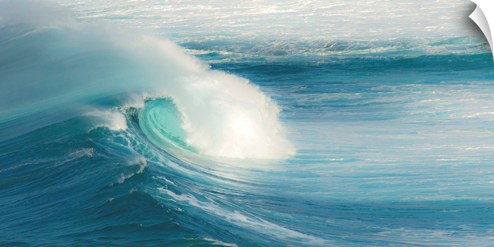 Close-up photograph of a large crashing wave in Maui.