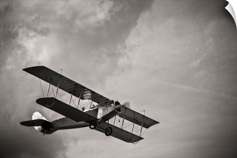 A fully restored Curtiss JN-4 "Jenny" flies over the grass strip at Peachstate Aerodrome in Williamson, Georgia.