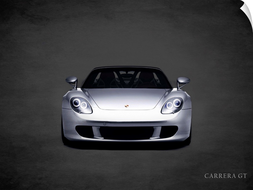 Photograph of a silver Porsche Carrera GT printed on a black background with a dark vignette.