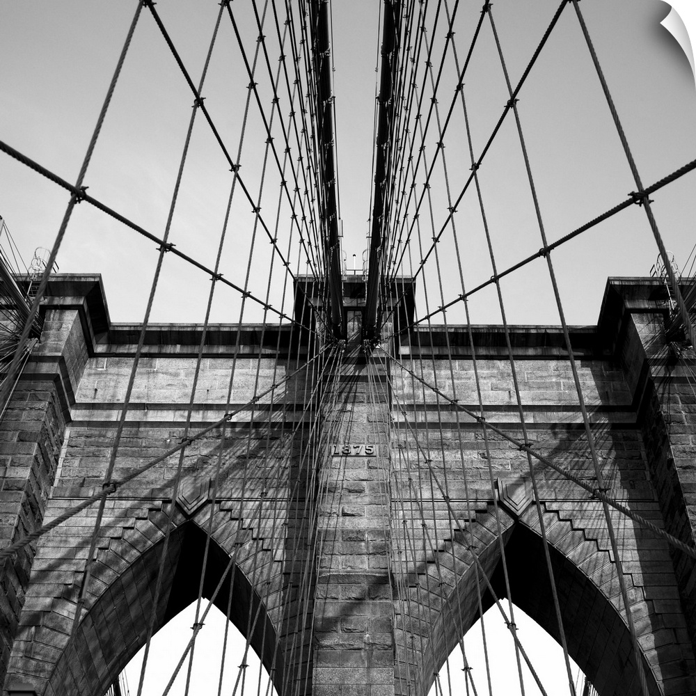 Black and white close up of the Brooklyn Bridge.