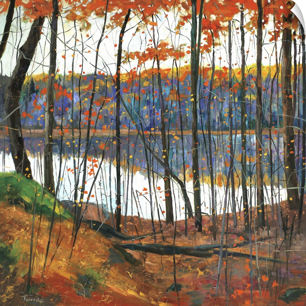 A colorful fall scene of a forest surrounding a lake with the trees reflecting in the water.