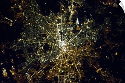 Berlin at night, from space. The light bulbs still show the East/West division.