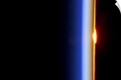 Our atmosphere acts as a lens, distorting the sun as it crosses the horizon