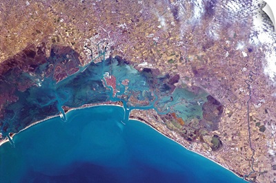 Venice's red roofs and white docks are visible from orbit - the Grand Canal too