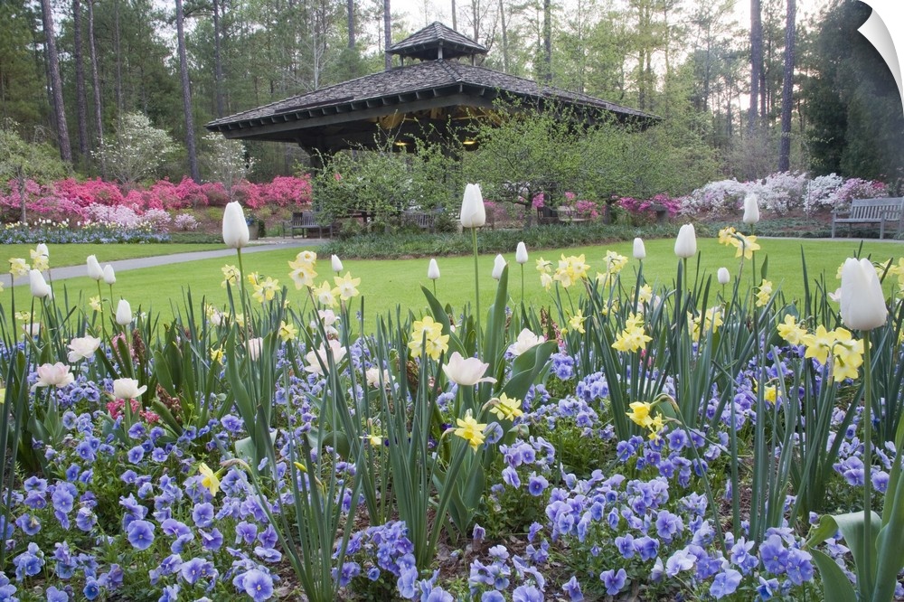 USA, Georgia, Pine Mountain. A covered pavilion in a garden of spring flowers.