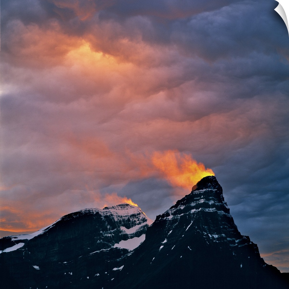 Canada, Alberta, Mt. Chephren. A snow plume catches light from the setting sun on Mt. Cephron Banff NP, a World Heritage S...
