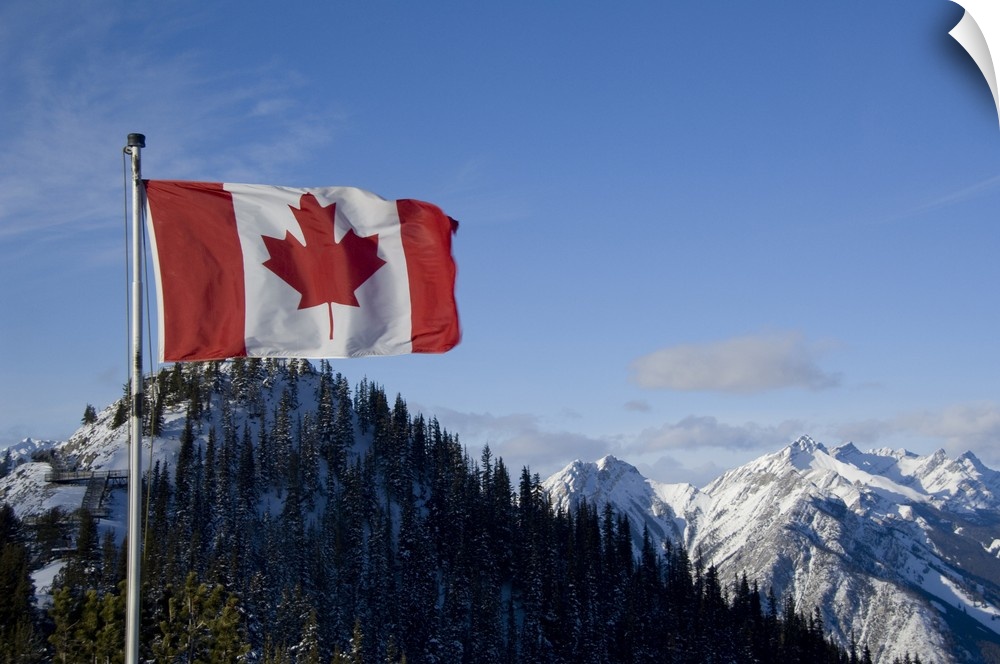 Canada, Alberta, Banff. Mountain views with Canadian flag on the summit of Sulphur Mountain.