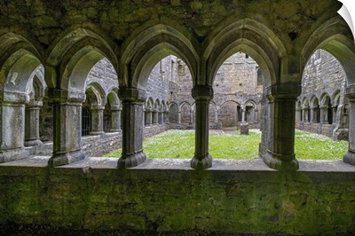 Ancient Cloisters Surround This Patch Of Grass At Moyne Abbey, County Mayo, Ireland