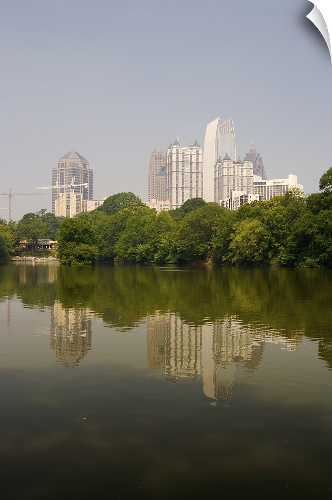 North America, USA, Georgia, Atlanta. Atlanta skyline and its reflection seen in a pond at Piedmont Park.
