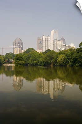 Atlanta skyline and its reflection seen in a pond at Piedmont Park