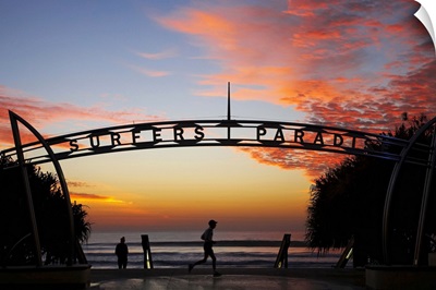 Australia, Queensland, Gold Coast, Jogger and Sign at Sunrise, Surfers Paradise