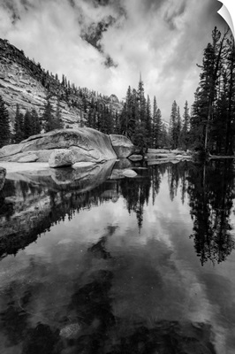 California, Yosemite National Park. granite outcropping with boulders, clouds, lake